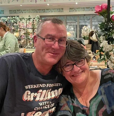 Dave and Marian, your hosts, smiling together